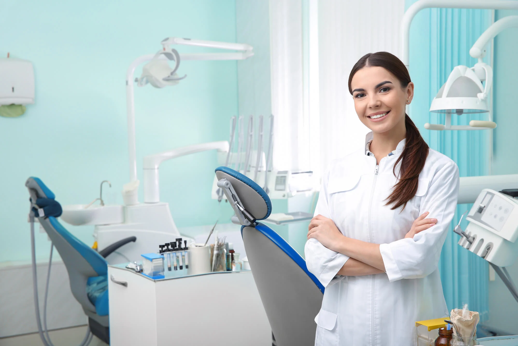 a Dentist in Montgomery in her treatment room smiling