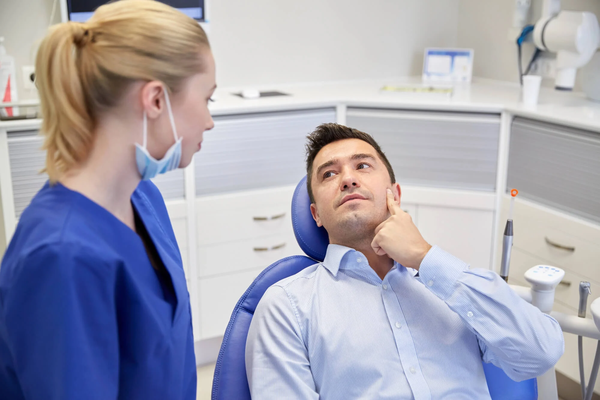 patient talking to dentist in montgomery about tooth sensitivity